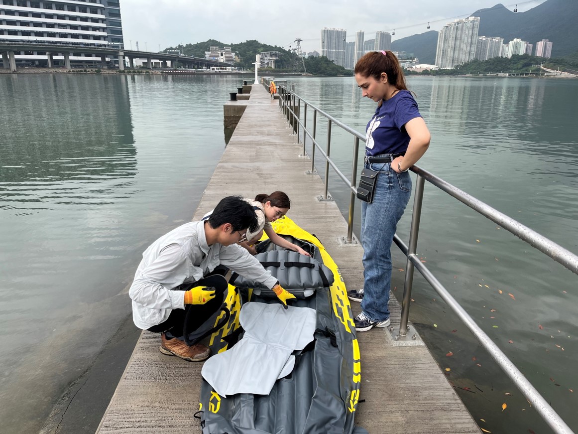 Water sampling and field preparation along the wetland shore